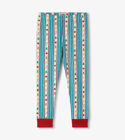 Kids pajama pants with red ankle cuffs and blue striped holiday print with trees, ornaments and gingerbread