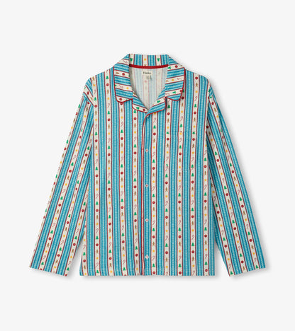 Close-up of pajama shirt with blue holiday stripe print, red piping and chest pocket