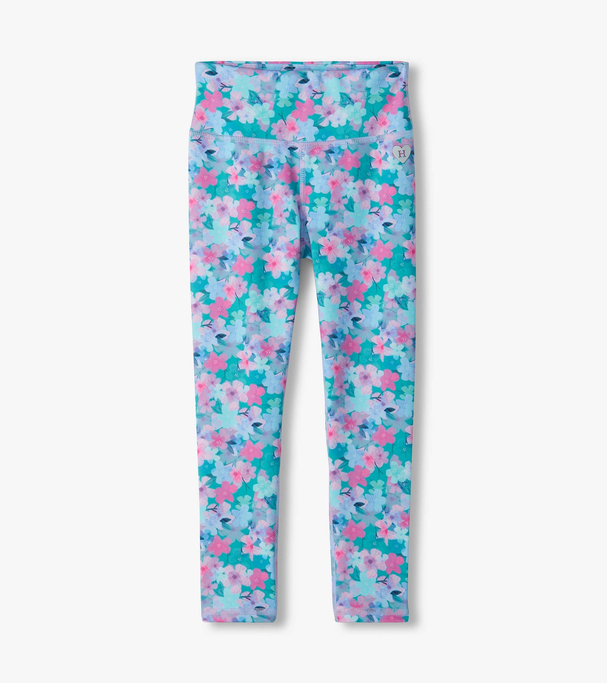 Kids active leggings with a teal background and pink, lilac, and light blue floral print