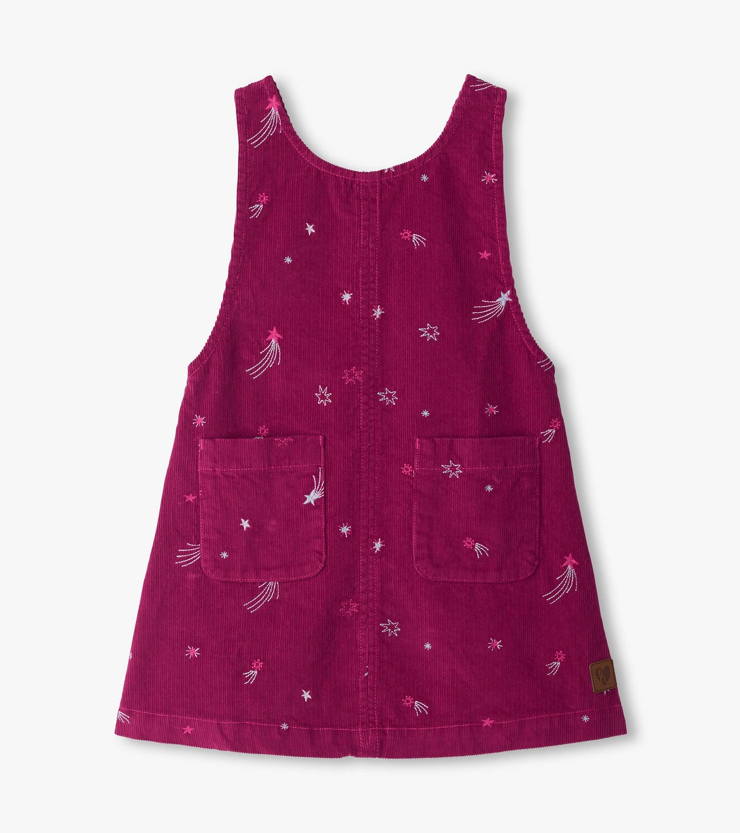 Front of pink pinafore dress with embroidered stars, front pockets, and a square neckline