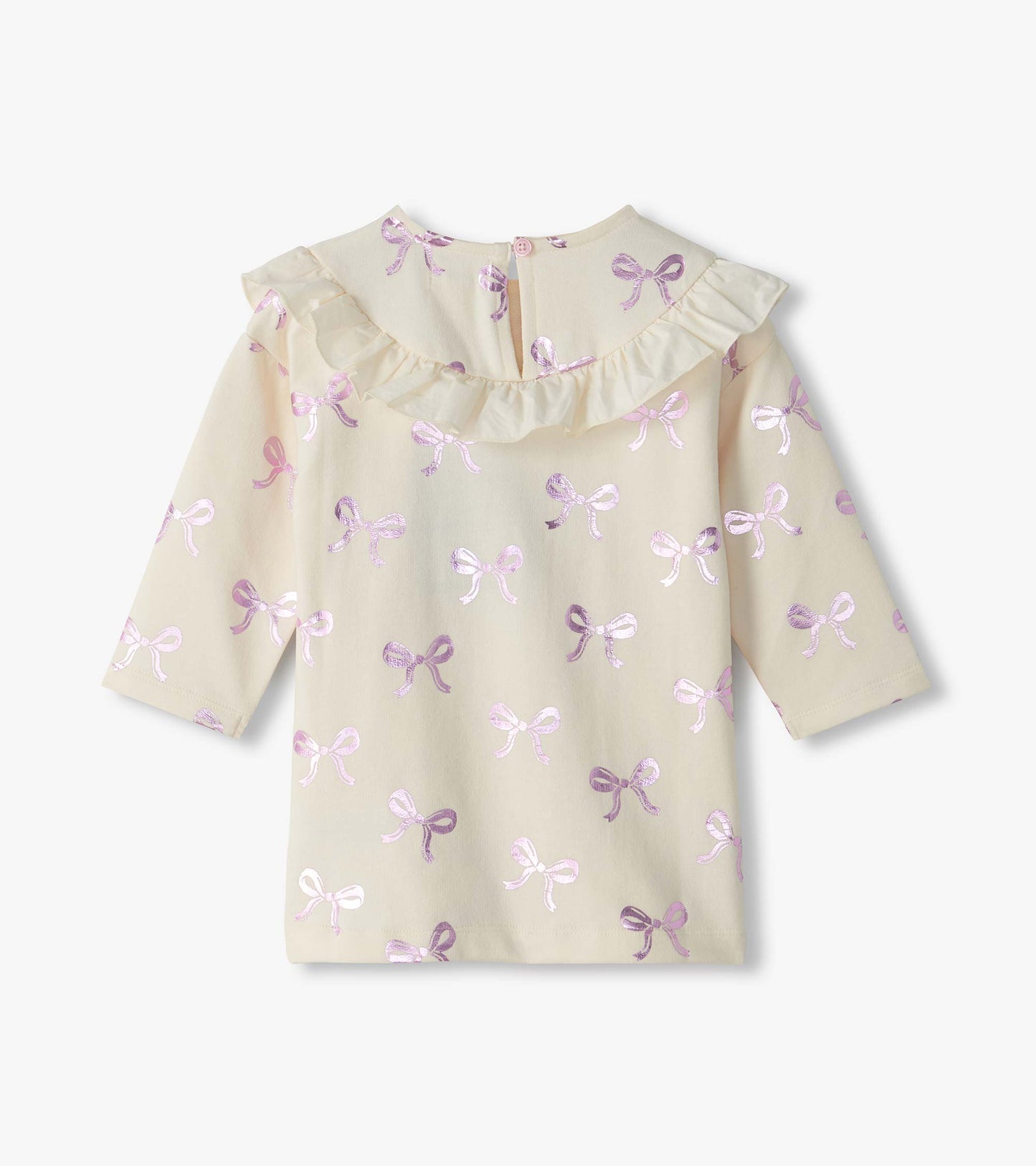 Back view of infant cream dress with pink foil bow print, ruffle yoke, and button keyhole closure
