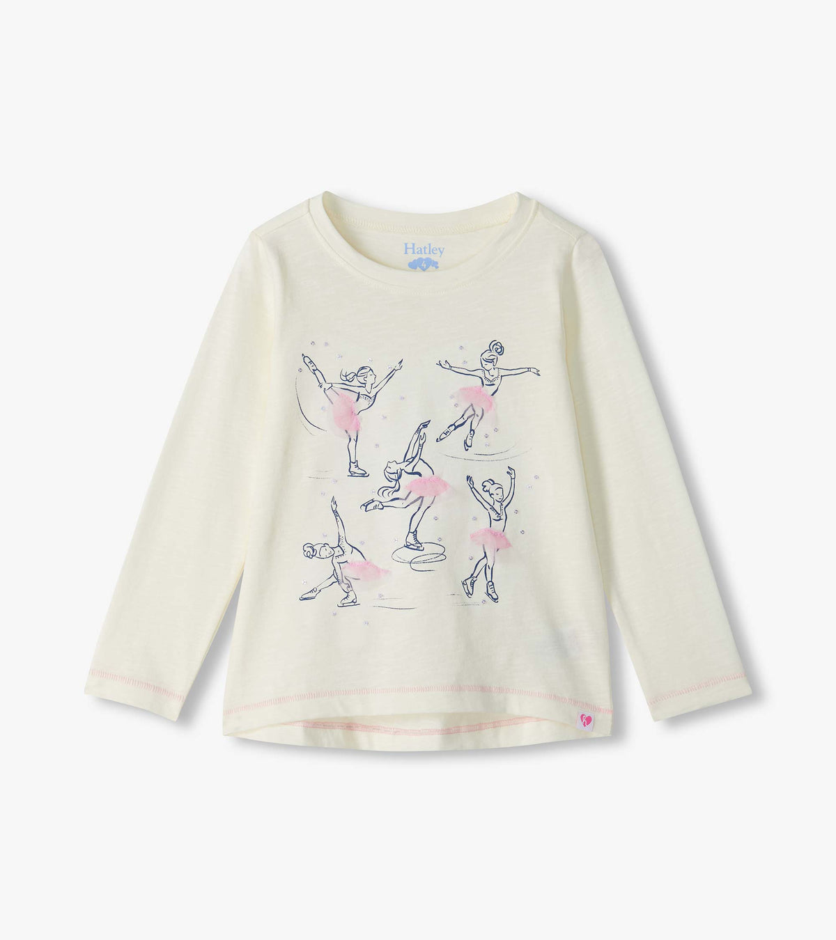 Cream long sleeve tee with figure skater graphics and pink tutu details on the front