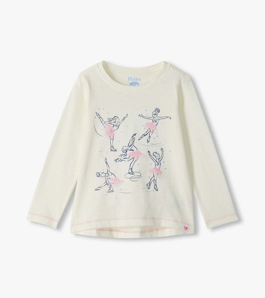 Cream long sleeve tee with figure skater graphics and pink tutu details on the front