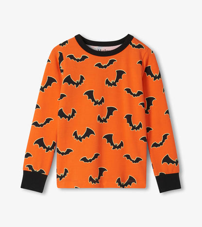 Orange long-sleeve pajama top with black bat print and black neck and wrist cuffs