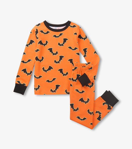 Orange boys pajama set with black bat print, long-sleeve top and matching pants with black cuffs