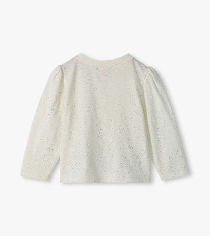 Back view of cream infant tee with silver speckles, puff shoulders, and long sleeves