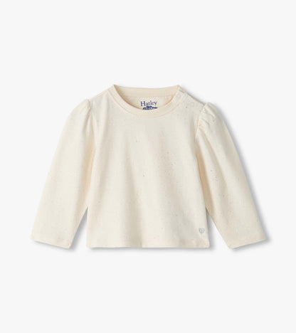 Front view of cream baby tee with silver speckles, puff sleeves, shoulder snaps, and small heart at hem