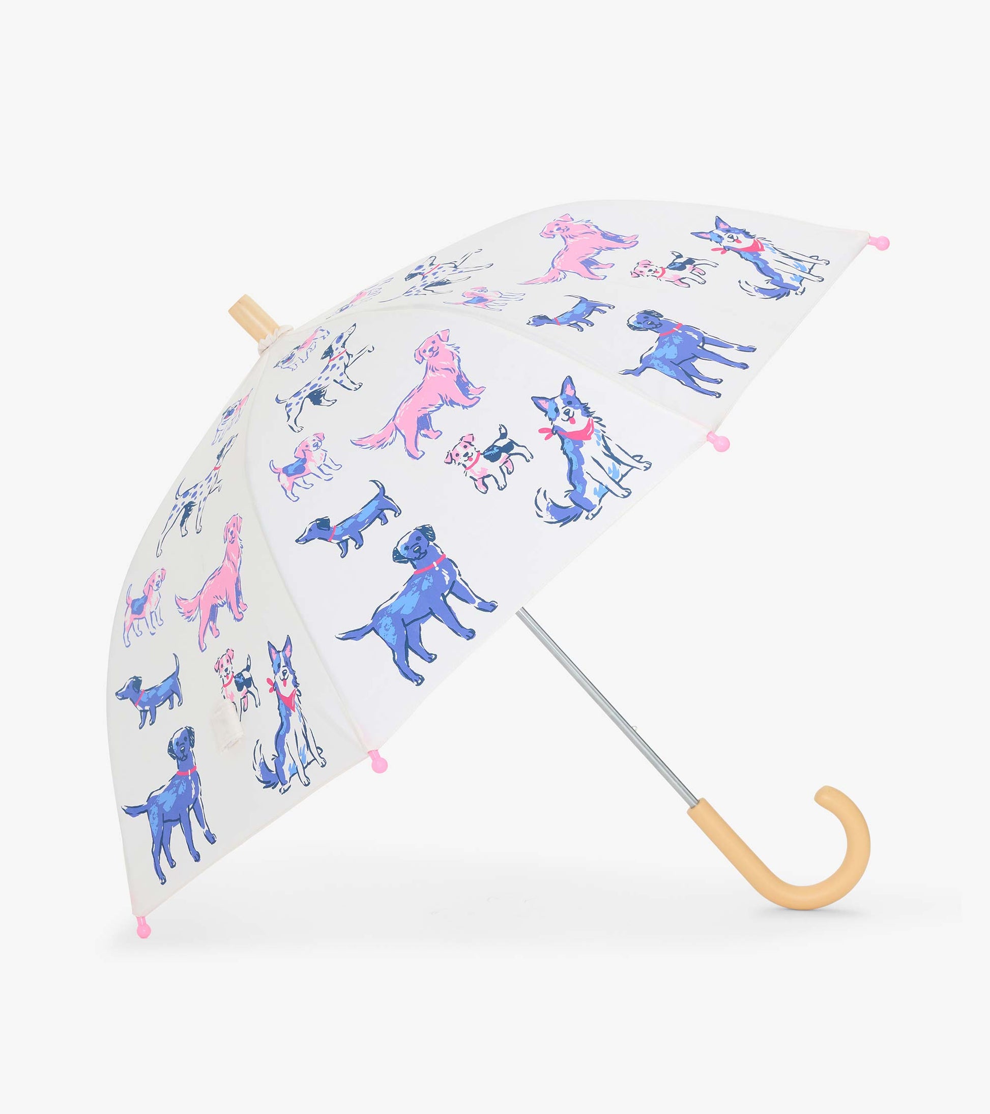 Clear kids umbrella with colorful dog print, pink tip covers, and curved beige handle