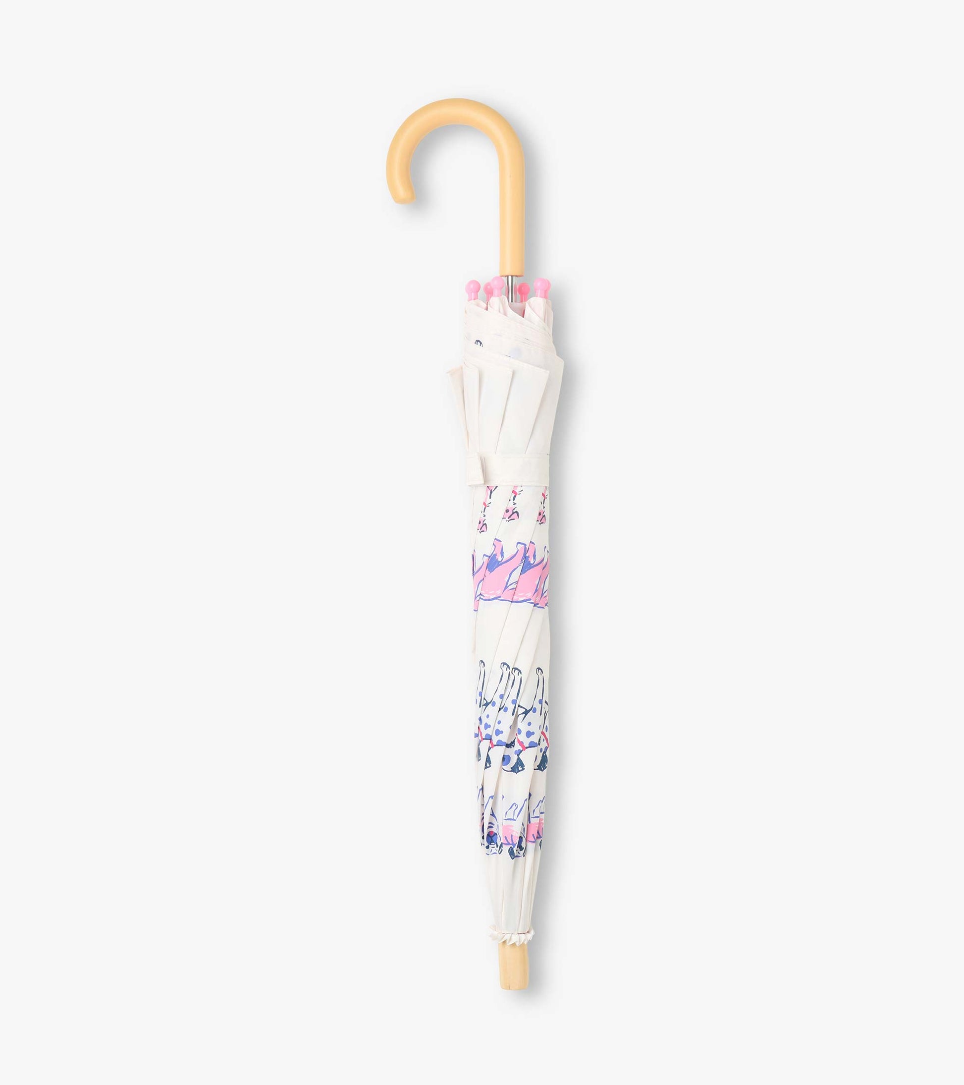 Closed clear umbrella with dog print, pink rounded tips, and curved beige handle