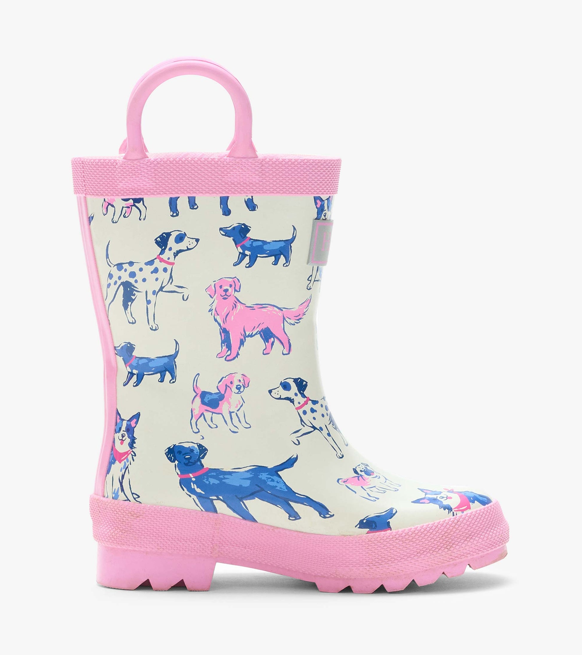 Single cream rain boot with pink handle and trim, featuring pink and blue dog illustrations