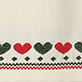 View Girls Holiday Hearts Swing Sweater Dress cream knit swatch with alternating green and red hearts and a red zigzag border