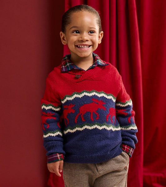 Toddler boy wearing a red and navy moose sweater with a shawl collar and button closure