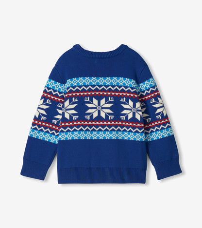 Back view of boys blue Fair Isle sweater with white snowflakes and red, white, and teal bands