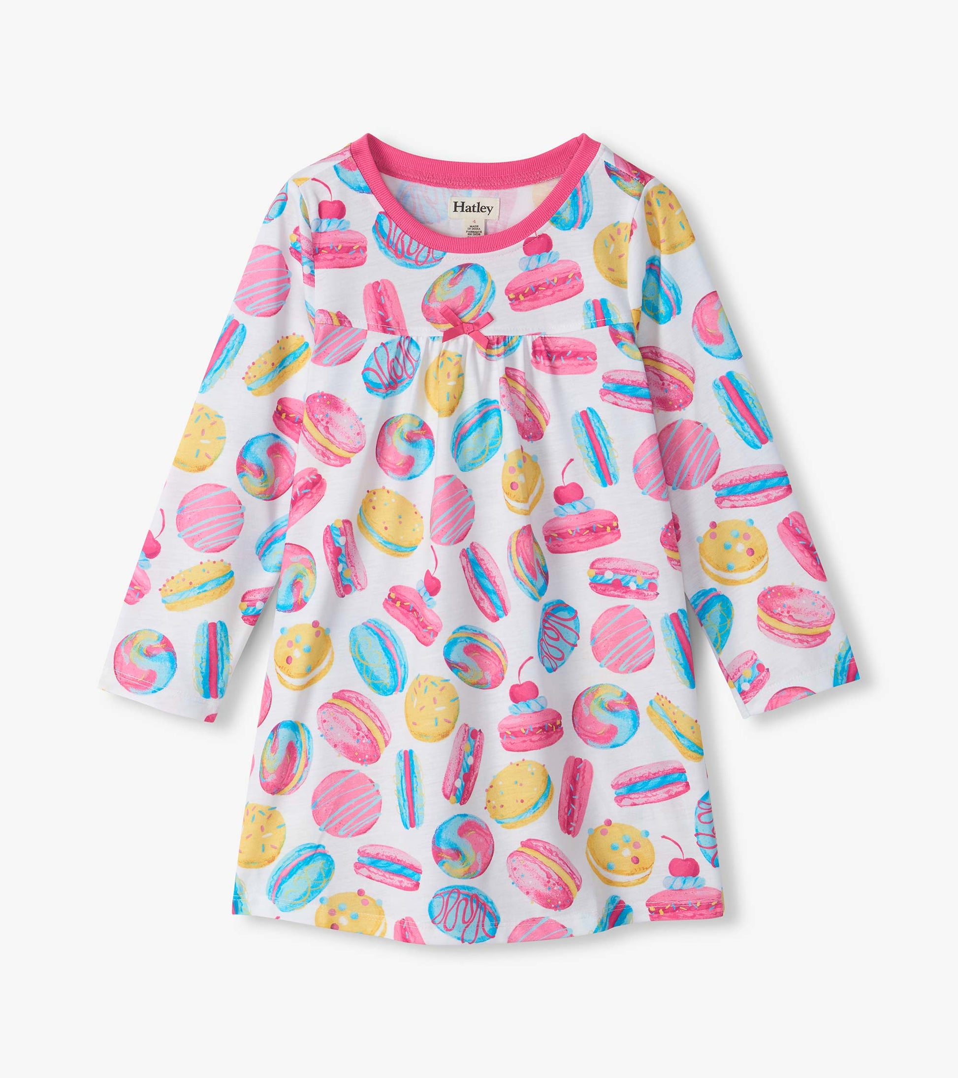 Kids long-sleeve nightdress with pink trim, bow detail, and colorful macaron and pastry print