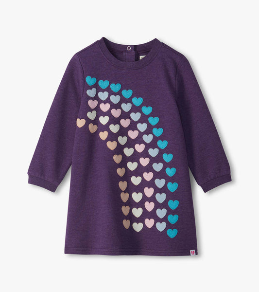 Infant purple long-sleeve dress with multicolor heart appliqués cascading diagonally down the front