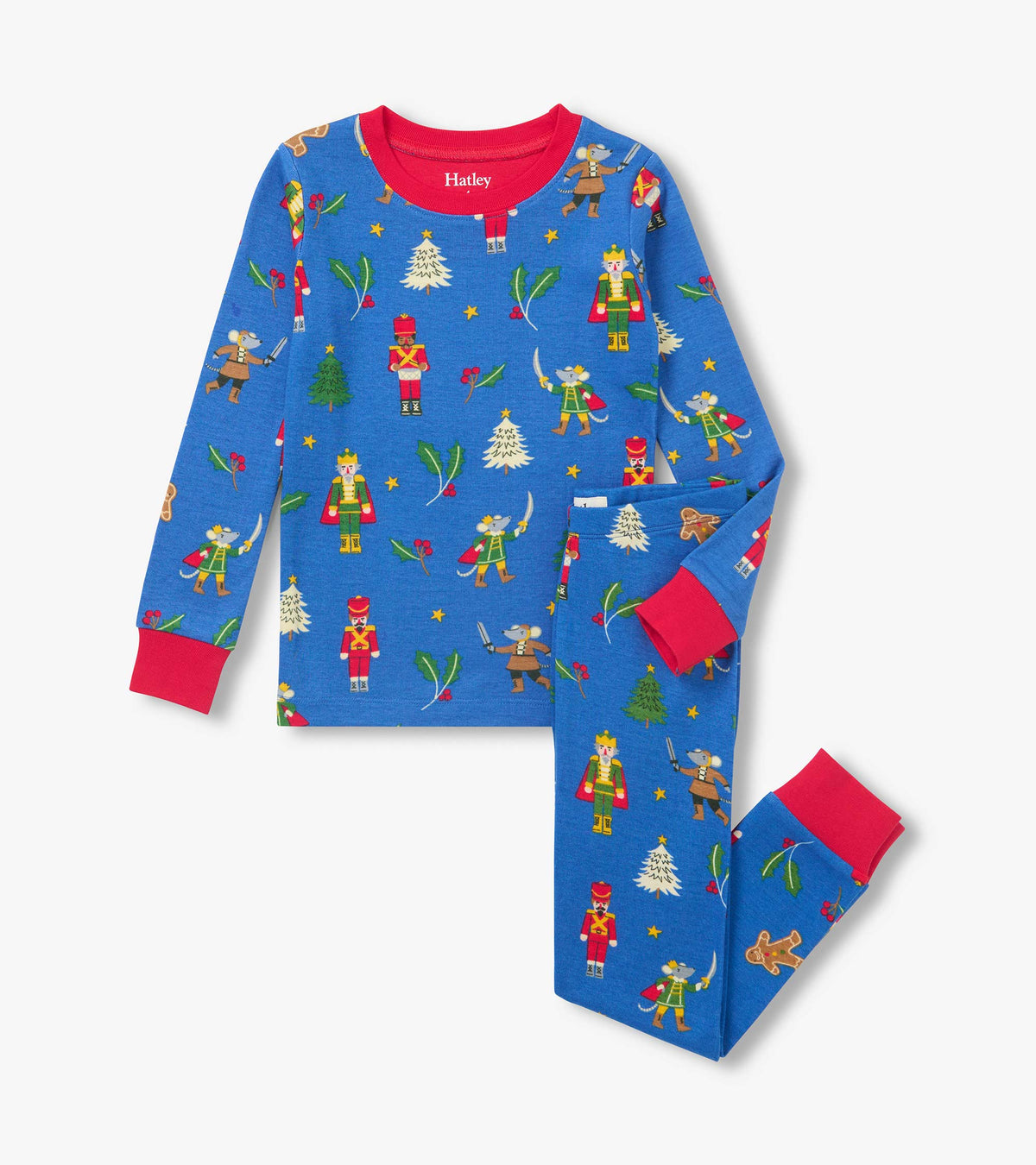 Blue boys pajama set with red cuffs and collar, covered in nutcrackers, mice, trees, holly and gingerbread men