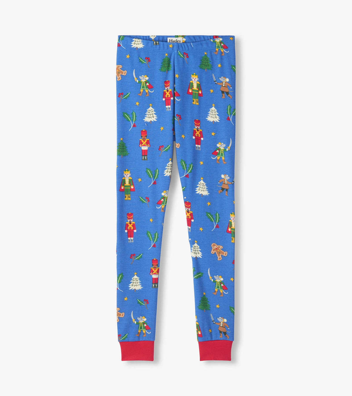 Blue pajama pants with red ankle cuffs, printed with nutcrackers, mice, trees, holly and gingerbread men
