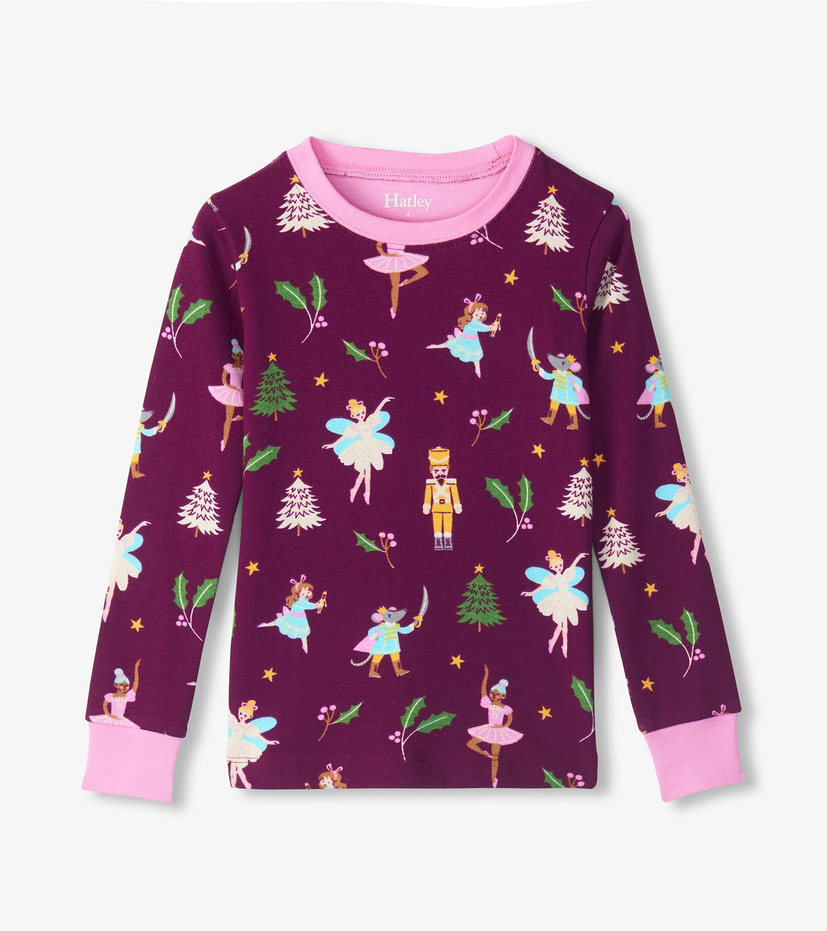 Purple long sleeve pajama top with pink neckline and cuffs, printed with ballerinas, Nutcracker soldiers, holly and trees