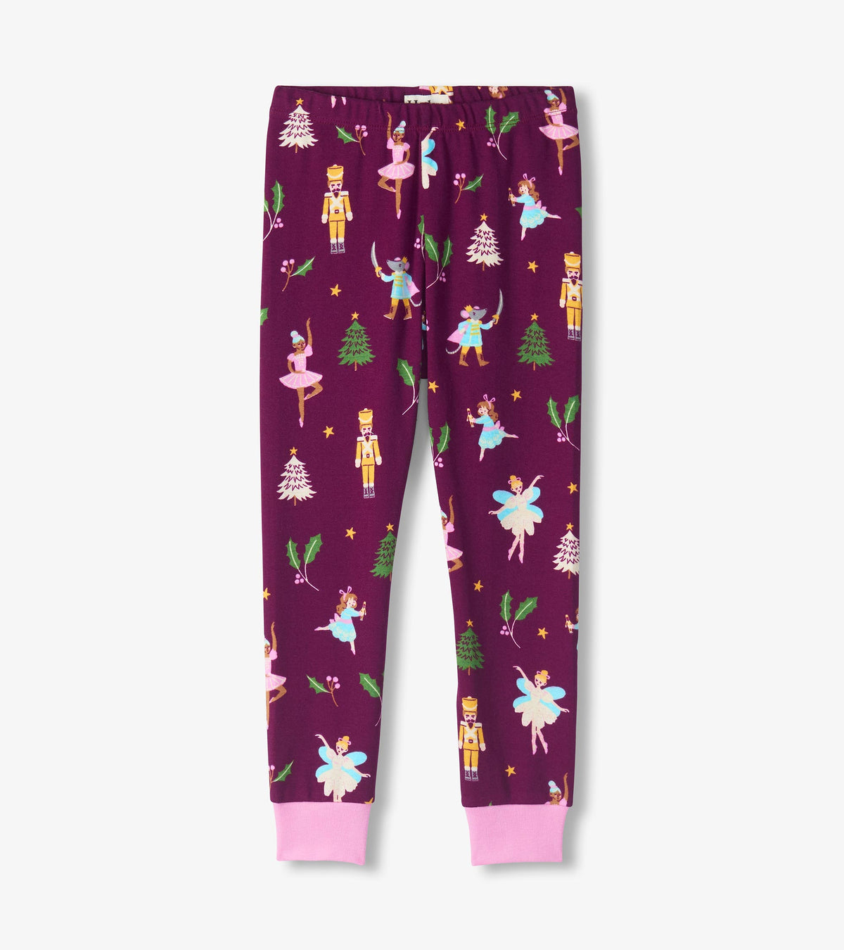 Purple pajama pants with pink cuffs and Nutcracker print featuring ballerinas, soldiers, holly and trees