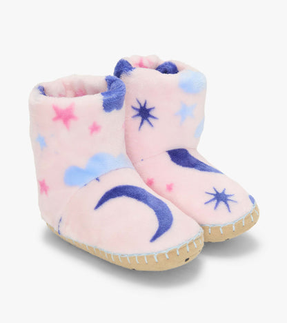 Pair of kids bootie slippers in pale pink with blue moons, stars, and clouds