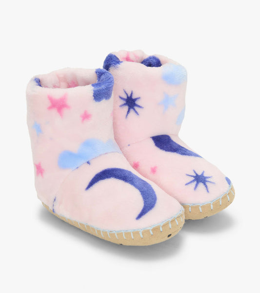 Pair of kids bootie slippers in pale pink with blue moons, stars, and clouds