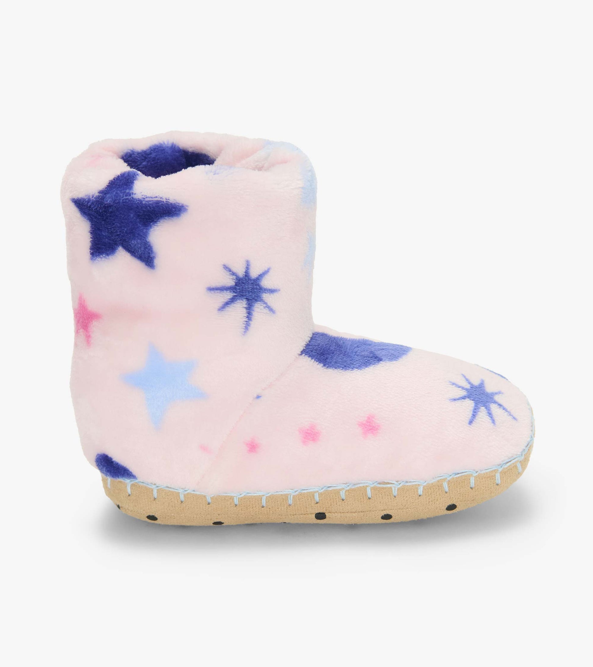 Single pale pink kids bootie slipper with blue and pink star and moon print, side view