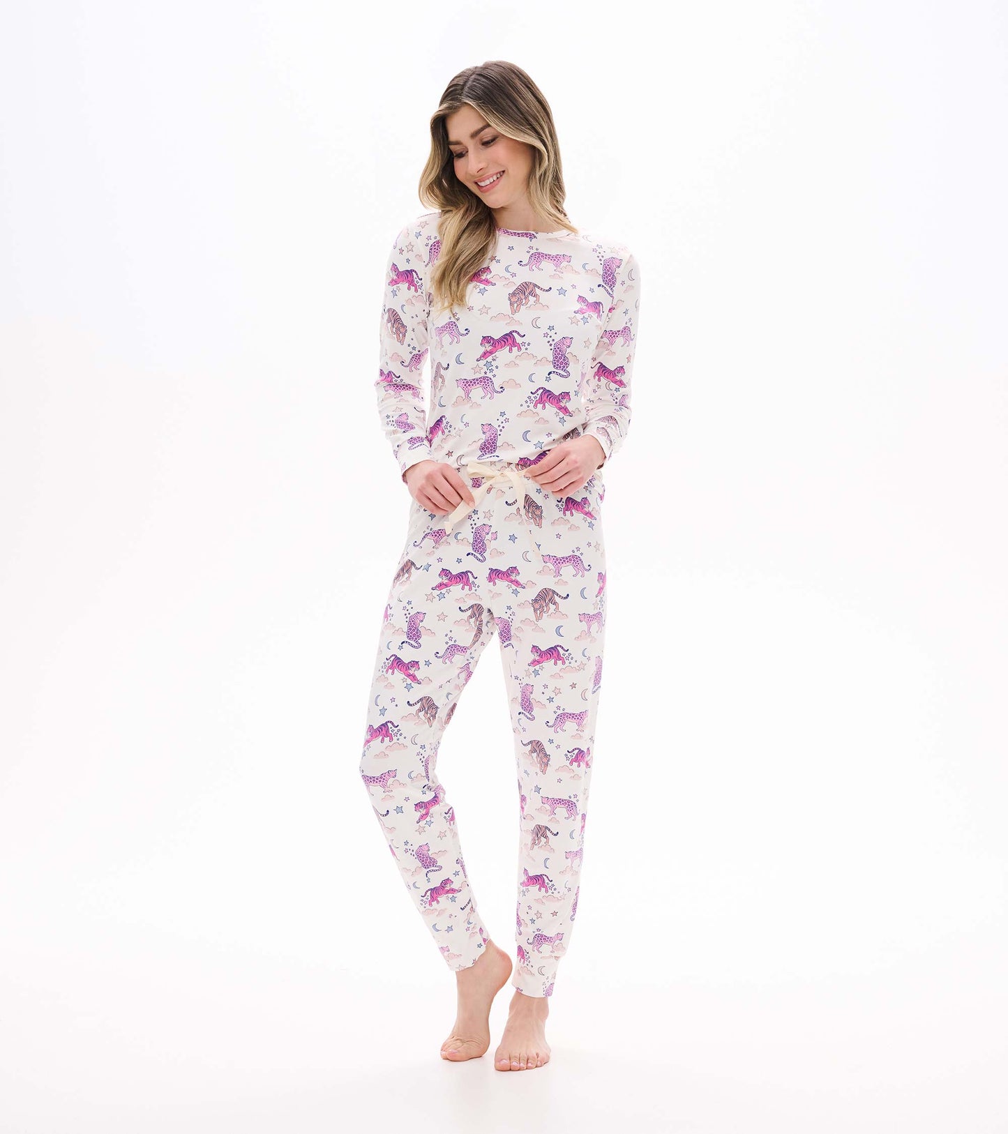 Women's tiger print pajama set with long sleeve top and drawstring pants, angled front view