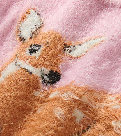 Close-up of the pink fuzzy knit and fawn graphic detail on the sweater