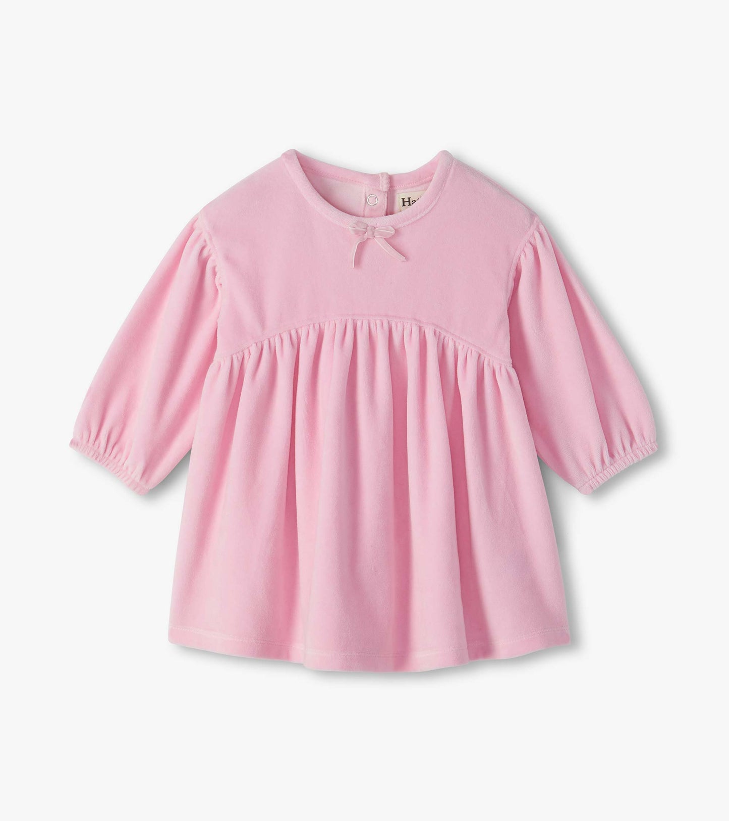 Infant orchid pink dress with long sleeves, gathered waist, round neck, and small bow detail