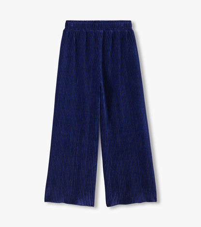 Back view of navy pleated relaxed pants with an elastic waistband and wide legs