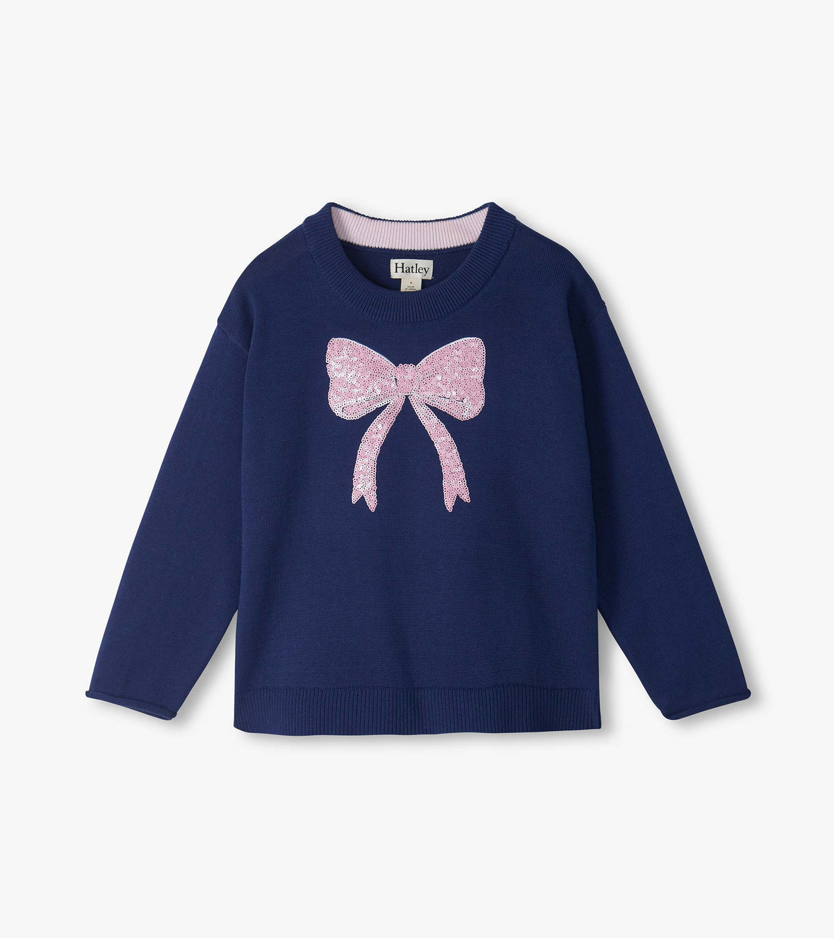 Front view of navy crew neck sweater with long sleeves and pink sequin bow on the chest