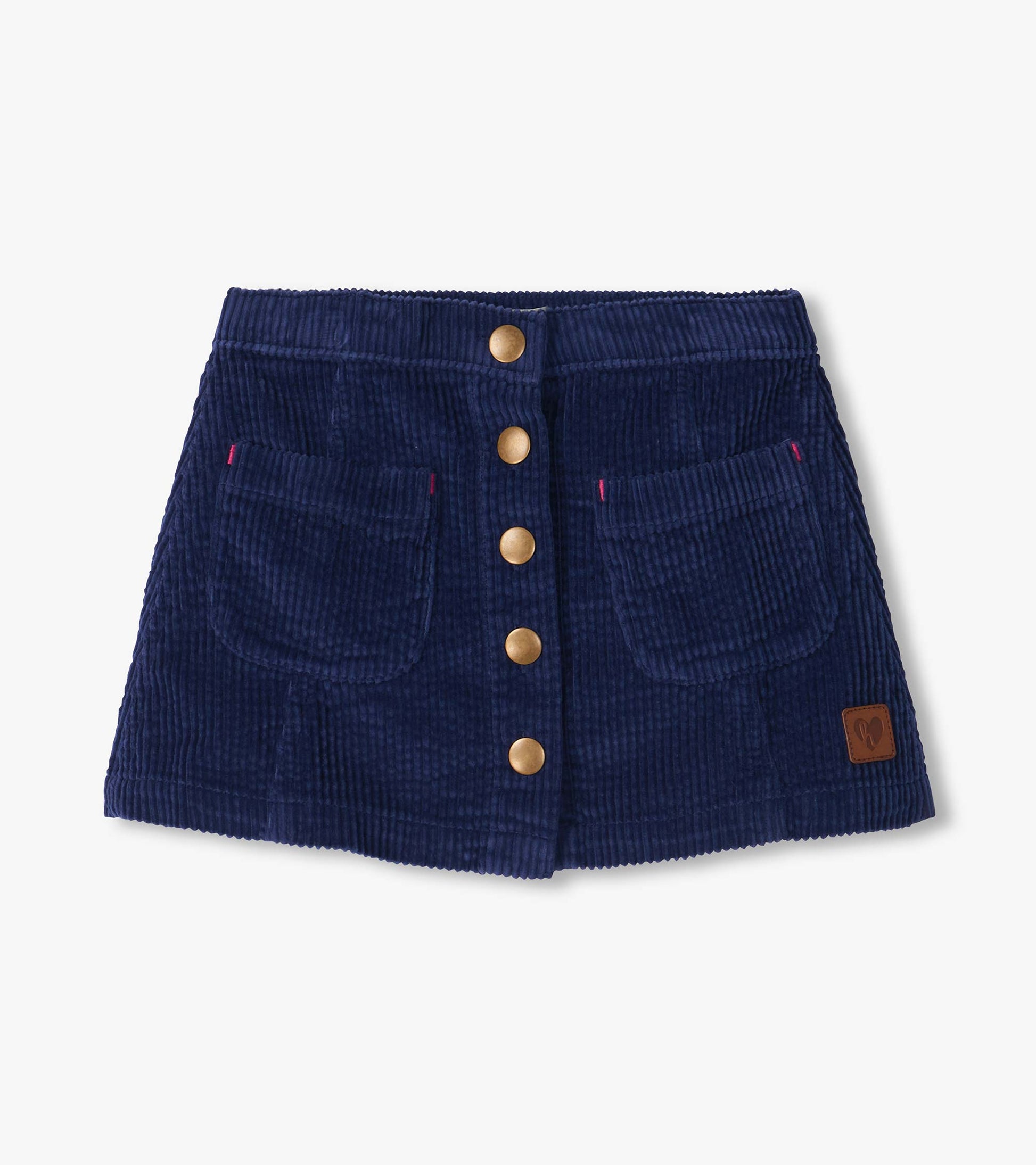 Patriot blue A-line skirt with front snap buttons, two flap pockets, and a small logo patch near the hem