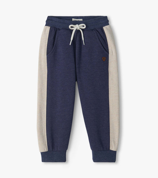 Blue melange infant track pants with cream side panels, drawstring waist, front pockets, and cuffed ankles