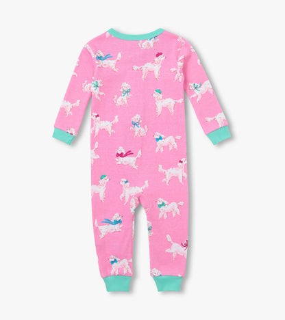 Back view of pink infant coverall with white poodle print, long sleeves, and teal cuffs