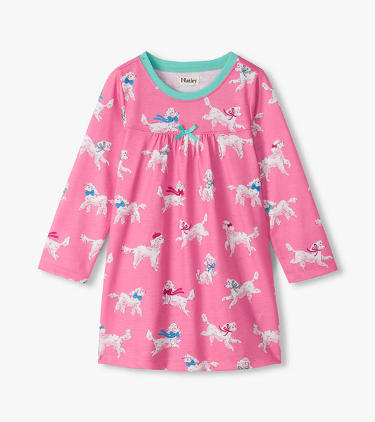 Pink long-sleeve nightdress with white poodle print, aqua neckline, and small bow at the chest