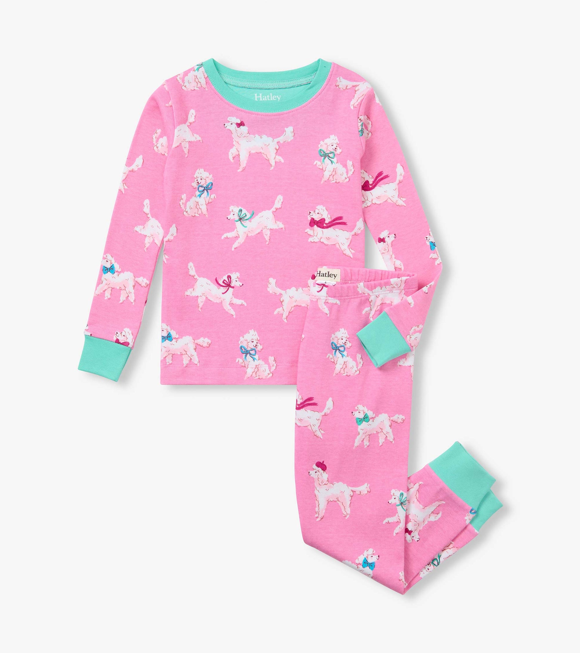 Kids pink pajama set with white poodle print and aqua trim on the cuffs and neckline