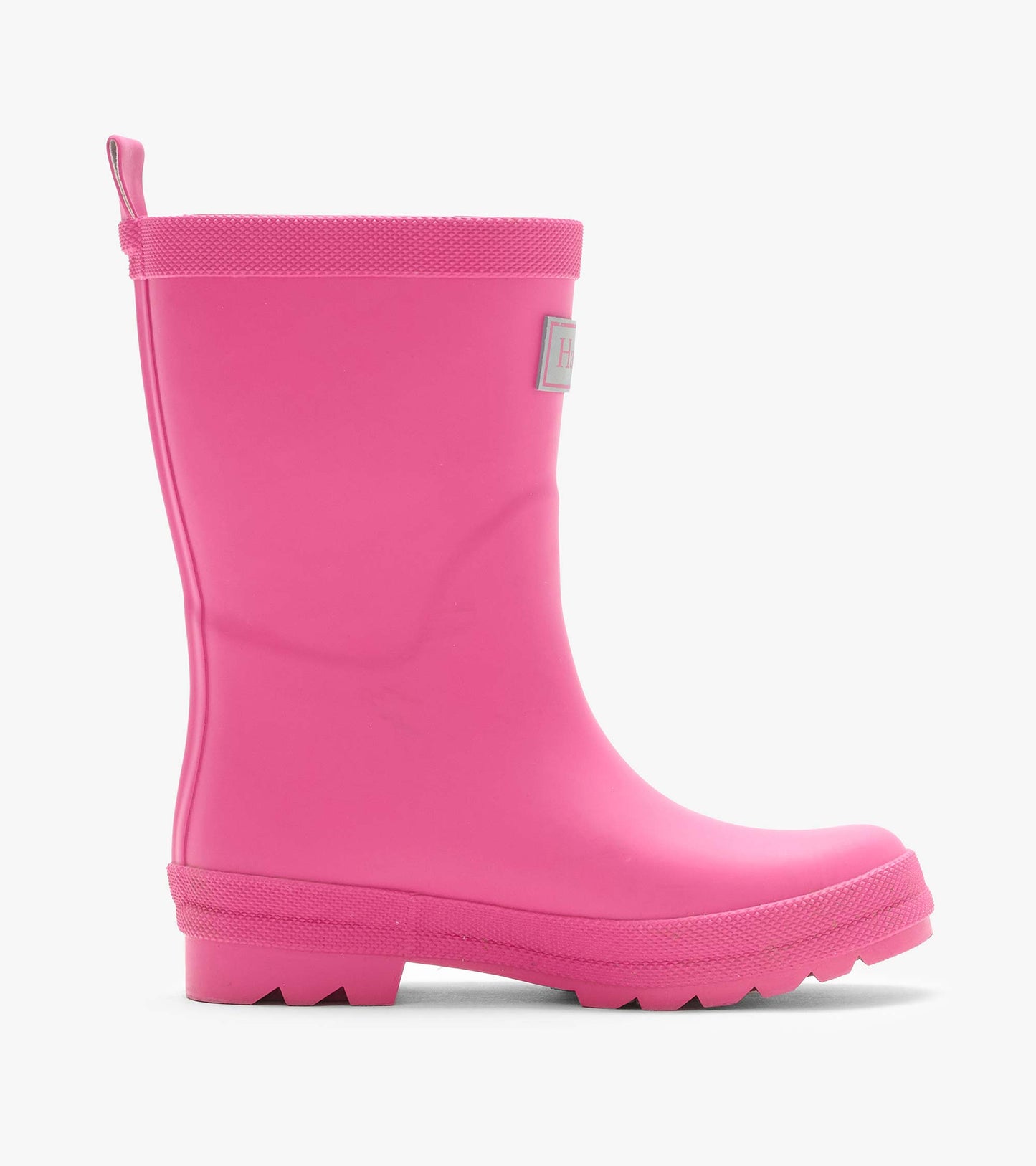 Side view of a bright pink kids rain boot with back pull tab and textured sole