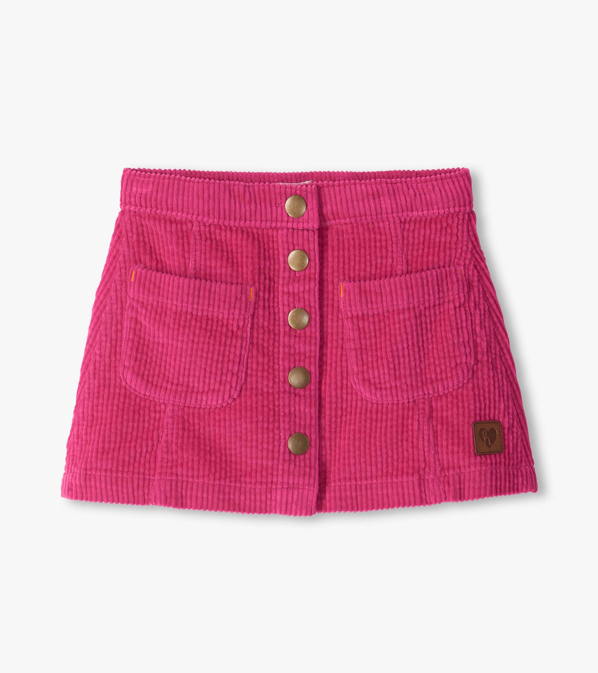 Pink A-line skirt with front snap buttons, two front pockets, and a small logo patch at the hem