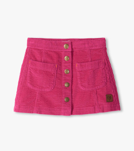 Pink A-line skirt with front snap buttons, two front pockets, and a small logo patch at the hem