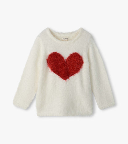 Front view of girls cream fuzzy sweater with long sleeves and a large red heart on the chest