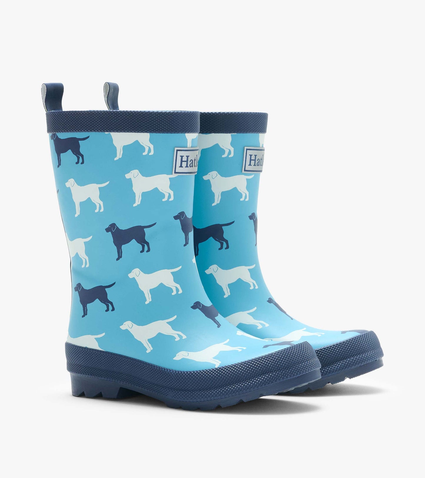 Pair of blue kids rain boots with white and navy dog silhouettes and dark navy trim