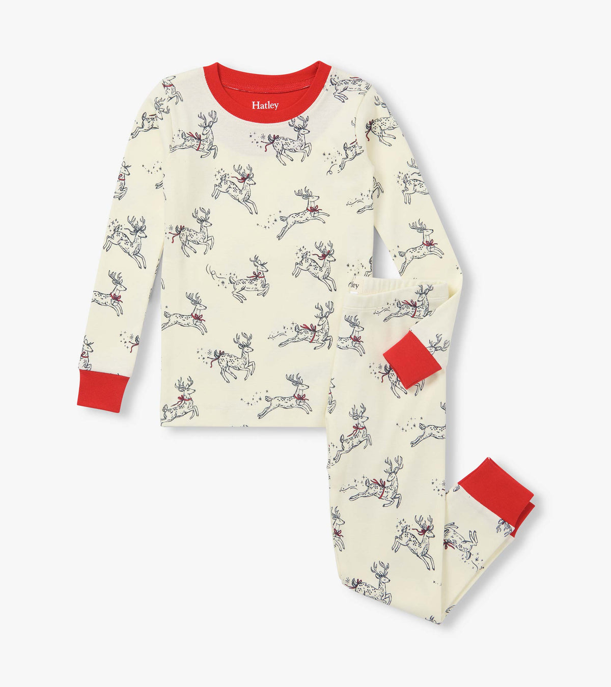 Girls two-piece cream pajama set with leaping reindeer print and red trim at the neck, cuffs and ankles
