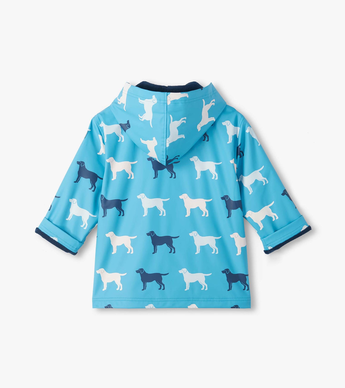 Back view of blue hooded rain coat with white and navy dog print and folded cuffs