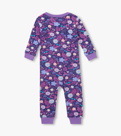 Back view of infant coverall in purple floral print with lavender cuffs