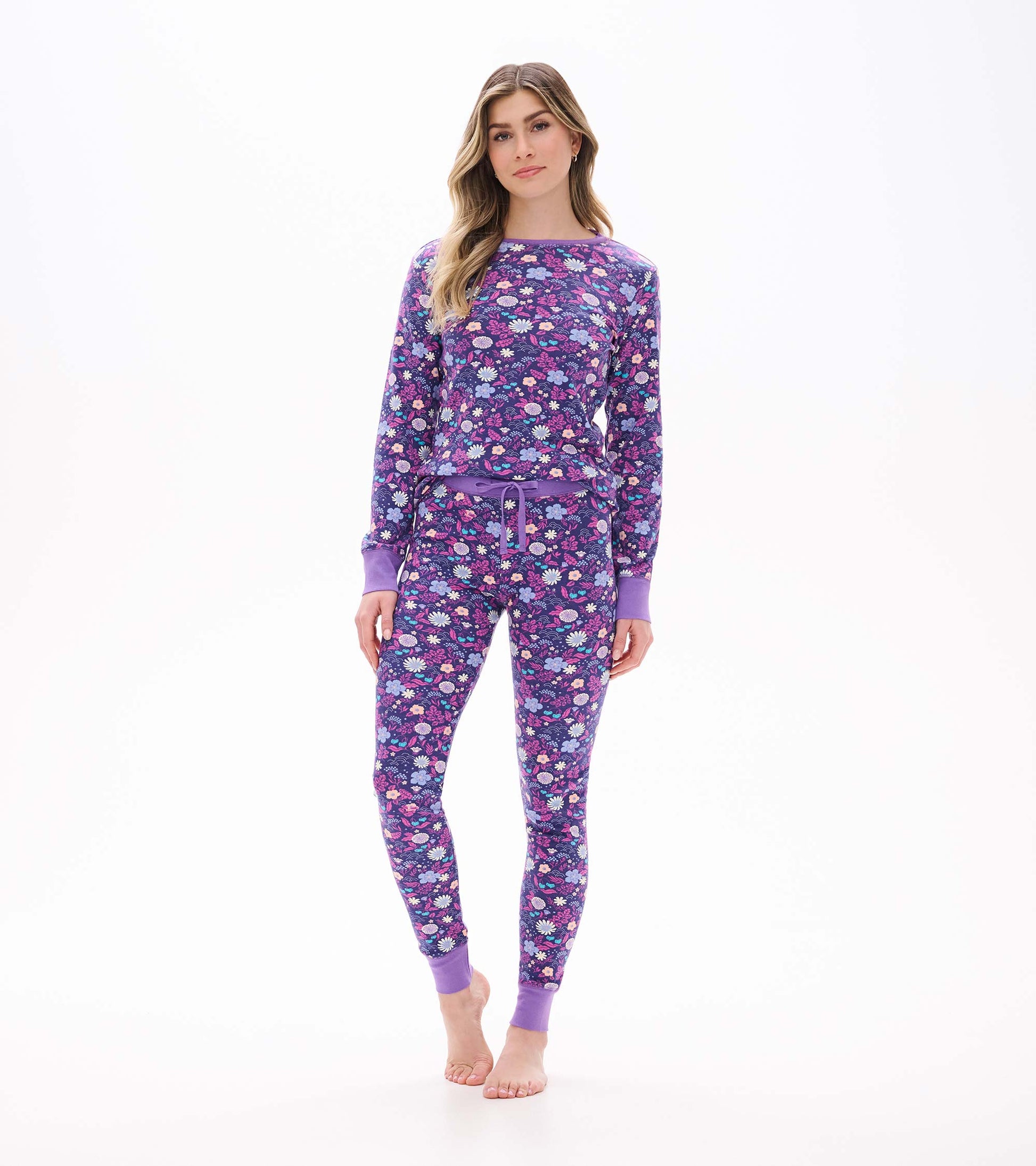 Front view of purple floral PJ set with long sleeves, jogger pants, lavender cuffs, and drawstring waist