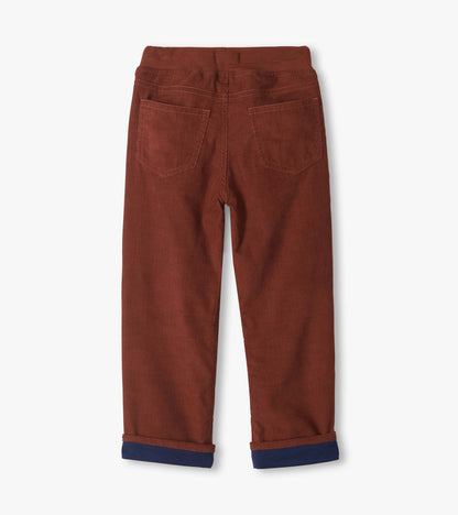 Back view of boys' tortoise brown pull-on pants with two back patch pockets and rolled cuffs