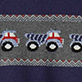 View Baby & Toddler Boys Trucks Shawl Collar Cardigan Dark gray knit swatch with a row of red, white, and blue trucks and zigzag stripes
