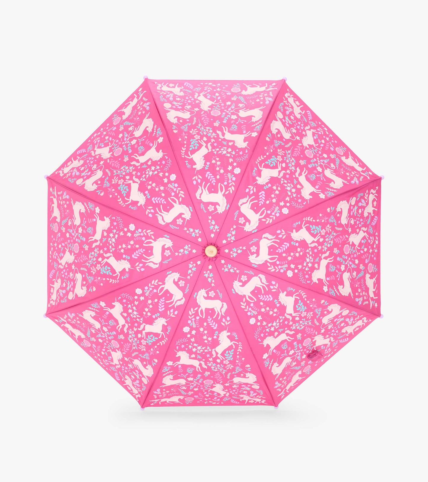 Top view of pink umbrella canopy with pale unicorns, flowers, and leaf motifs