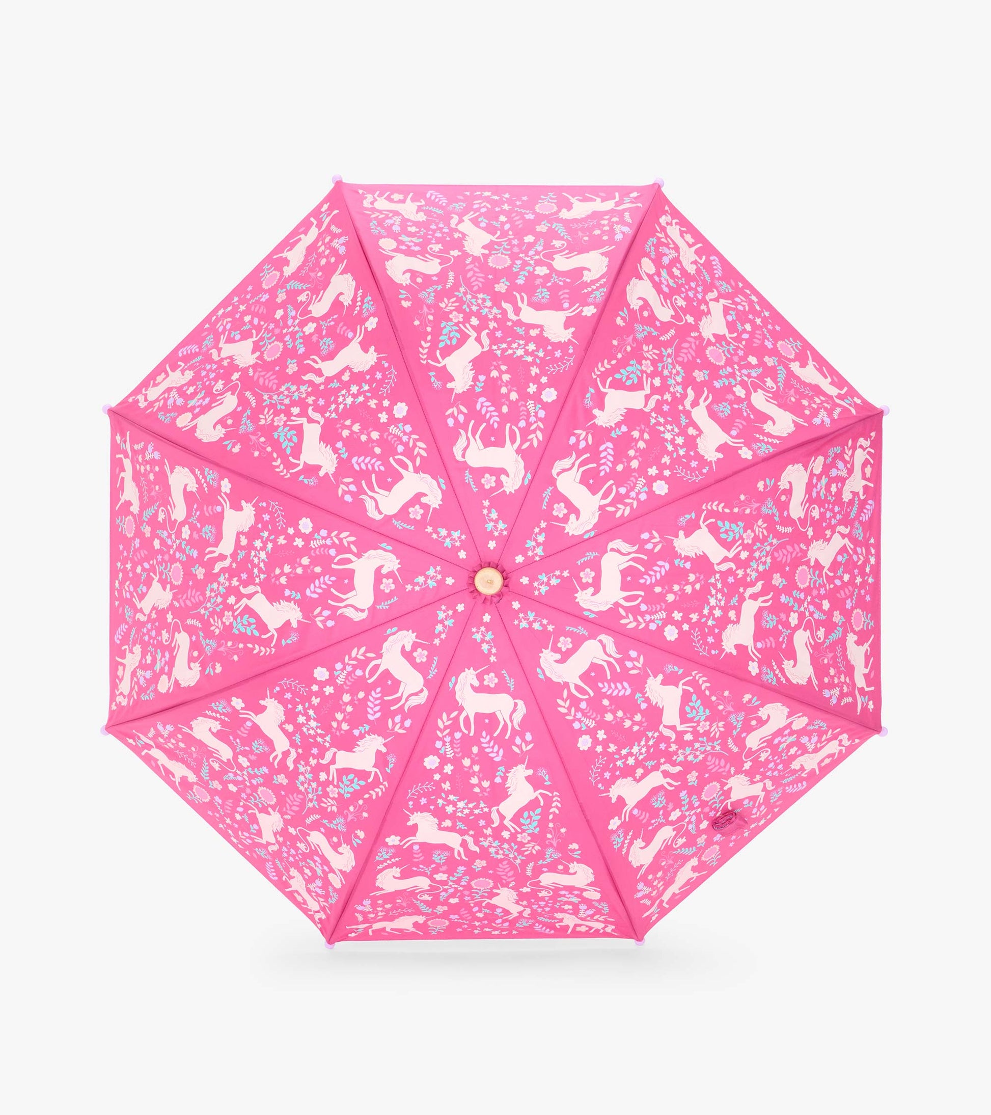 Top view of pink umbrella canopy with pale unicorns, flowers, and leaf motifs