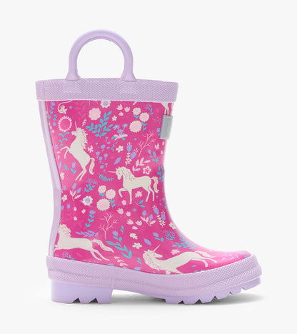 Side view of a pink kids rain boot with lilac handle, sole, and unicorn floral print